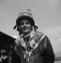 Woman in traditional costume of the Valais, 1946.