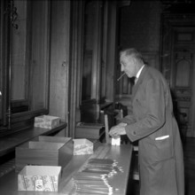 Federal Parliament, empolyees prepare for the session, sharpening pencils; 1960.