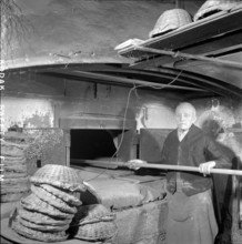 Baker in Wood Stove Bakery, 1957.