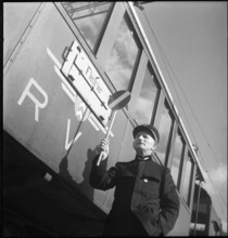 Val de Travers, station manager, train in St.-Sulpice; 1950.