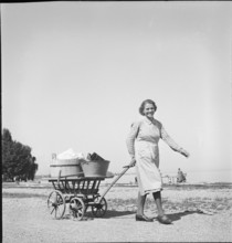 Woman with laundry to wash at Lake Constance, 1944.