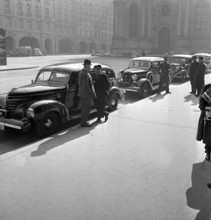 Berne, taxi driver waiting for clients; 1943.