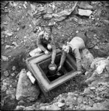 Brigerbad, boys getting water at Thermal spring; 1957.