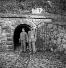 Bex, workers in front of gallery entrance of a salt mine, salt works; 1940.