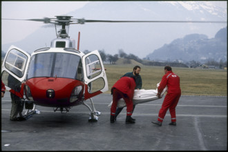 Rescue helicopter in action in the alps of Glarus 1992.