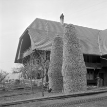 Tristen piled up pieces of firewood, in Bowil, 1964.