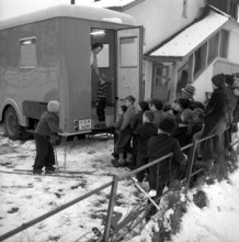 Mobile school dental clinic, children queuing for examination; 1955.