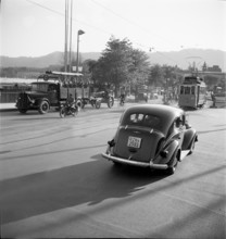 Military convoy in city traffic, Zurich 1948.