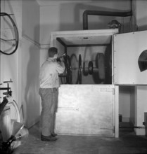 Recycling of tyres, spray booth; 1943.