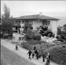 Curious onlookers visiting factory building after explosion, Stafa 1957.