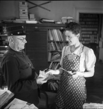 Letter-Carrier Handing over Money, 1943.