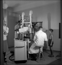 Boy at X-ray checkup against lung tuberculosis, Zurich 1945.