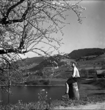 Boy sitting at the Finstersee lake shore, 1946.