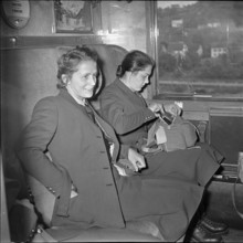Arrival at the railway station, in the train compartment.