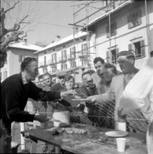 Public risotto meal at carnival in Ascona, 1955.