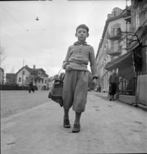 Boy with shopping bag on Mother's Day, 1941.