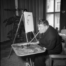 Mitglieder der Vereinigung mund- und fussmalender Kunstler stellen sich und ihre Werke vor.