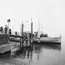 Passengers board a ship in Ascona, 1952.
