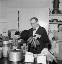 Preparing of sausages at carnival in Payerne, 1946.