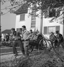 War fire brigade; men pulling hose cart; 1939.
