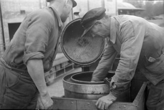 Workers learning how to use cars powered by wood gas 1941.