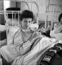 Disabled girl knitting, 1945.