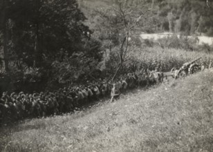 Soldiers towing artillery