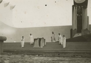 Actors on stage at the Greek Theatre of Syracuse. 
	
		1924