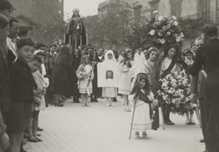 A procession. 
	
		1924