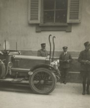Frederick Johnson next to a car. 1915-1925