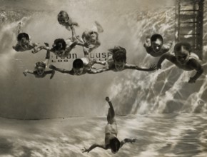 Children training underwater at a swimming school in the United States
