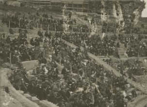 The Greek Theatre of Syracuse packed with people.