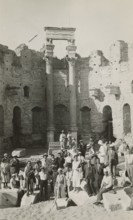 Excursionists in the Basilica of the Severi in Leptis Magna. 
	
		1931