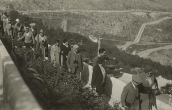 Members of the Touring Club Italiano stopping at a lookout point. 
	
		1924