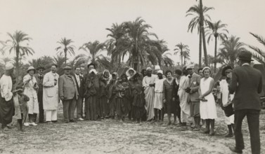 Excursionists in Libya together with some indigenous people. 
	
		1931