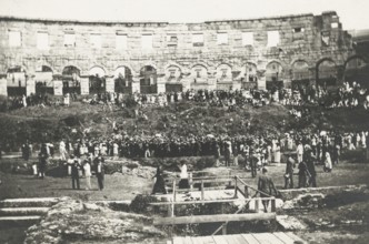 Members of the Touring Club Italiano  at the Pula Amphitheater. 
	
		1920
