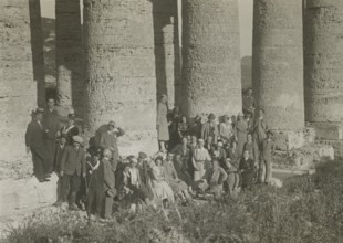 A group of visitors at the Temple of Apollo in Segesta. 1924