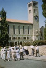 People walking towards Winthrop Hall Clock Tower building, University of Western Australia, Perth,