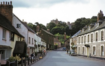 Dunster castle and historic buildings, main village street, High Street, Dunster, Somerset,