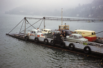 Cars and van on vehicle ferry, between Kingswear and Dartmouth, Devon, England, UK early 1960s.