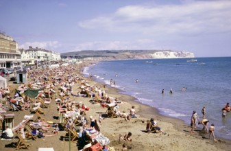 Crowds of holidaymakers on Sandown beach, Isle of Wight, England, UK 1962.