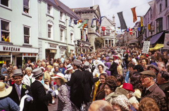Flora Day, Helston, Cornwall, England, UK 1973 - crowds watch couples perform the  Furry dance in