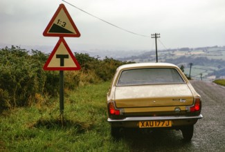 1 in 3 gradient road sign, near Grosmont, north Yorkshire, England, UK 1 September 1974 Hillman
