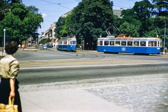 Blue streetcar trams trolleybuses in city centre, Zurich, Switzerland, Europe 1950s.