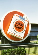 Lucky Strike cigarette advert, Philip Morris tobacco factory, thought to be Durham, North Carolina.