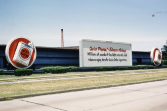 Lucky Strike cigarette advert, Philip Morris tobacco factory, thought to be Durham, North Carolina.