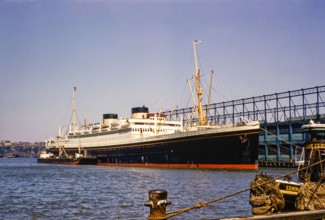 MV Britannic ocean liner Cunard Lines ship East River, Manhattan, New York, NY State, USA, c 1954.