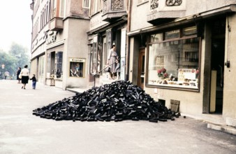 Delivery of coal piled in street outside shops Rottweil, Baden-Württemberg, Germany, Europe 1959.