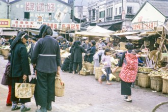 Country women at market, Tai Po, New Territories, Hong Kong, Asia, 1964.