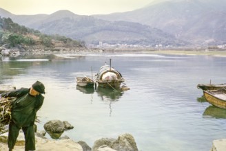 People living on sampan boats at  Tai Po Hoi, New Territories, Hong Kong, Asia, 1964 woman carrying